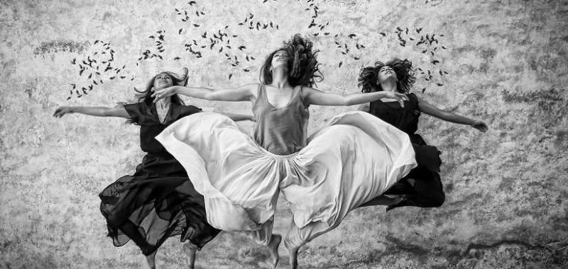 We are spiritual beings having a human experience, Three women jump in the air
